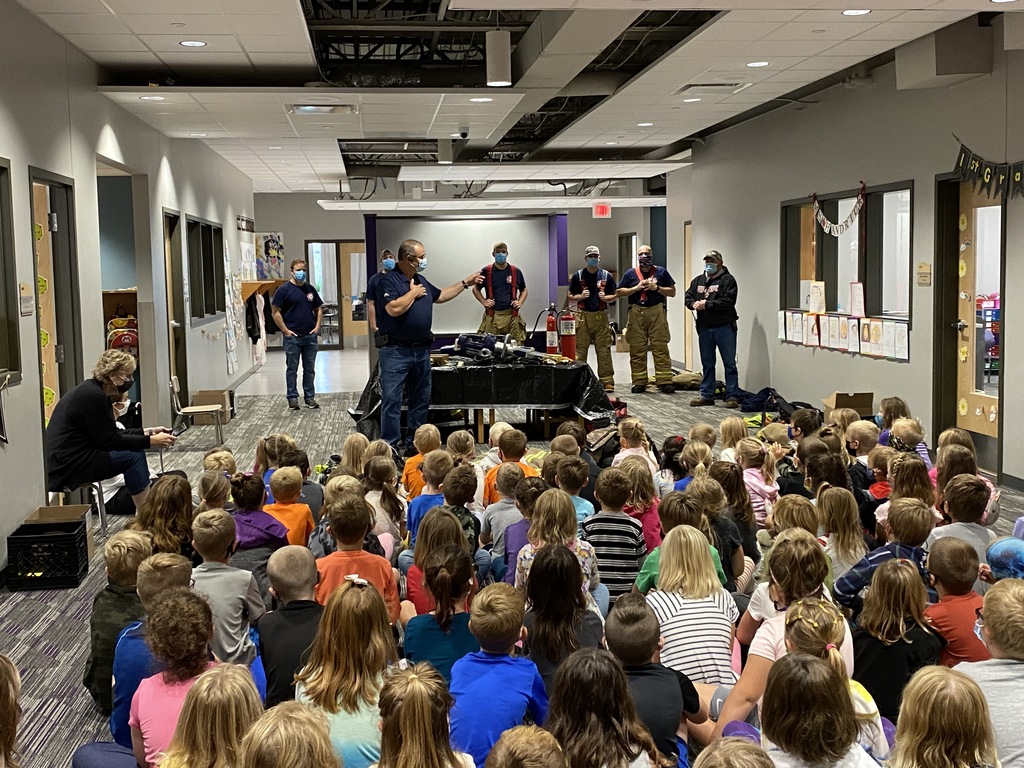 Firemen speak to children