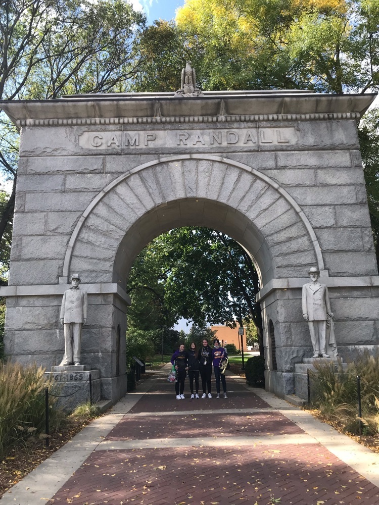 students in front of camp Randall arch